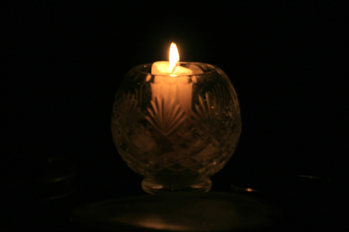 A candle against the dark night